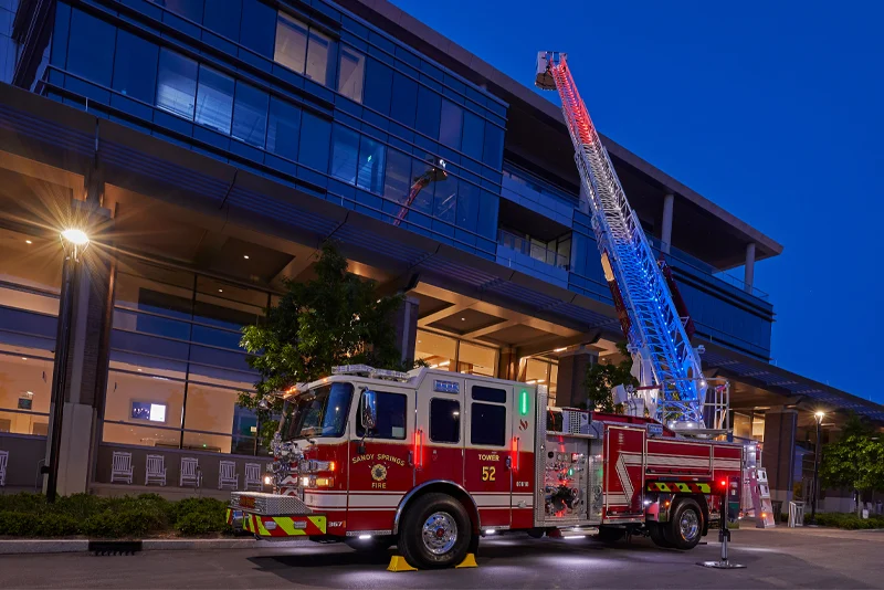 quint-fire-truck-with-ladder-raised.webp